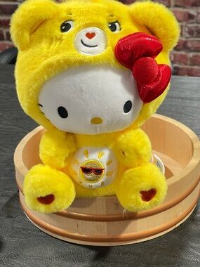 Hello Kitty Yellow Sunny Plush Toy with Red Bow in Care Bear costume
